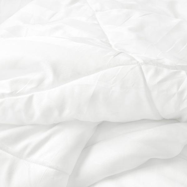 Close up top view of white bedding sheet and wrinkle messy blank percale duvet covers