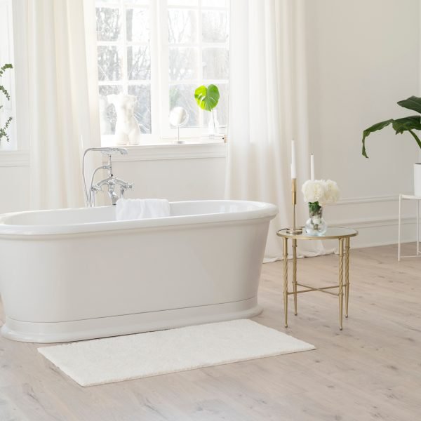 White modern bathroom with silver fittings with large sunny wind Bath Mat